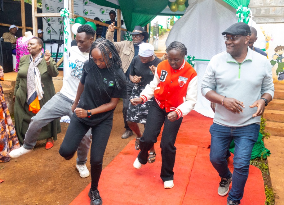 Learners and guests dancing together during the Cha Mama launch.