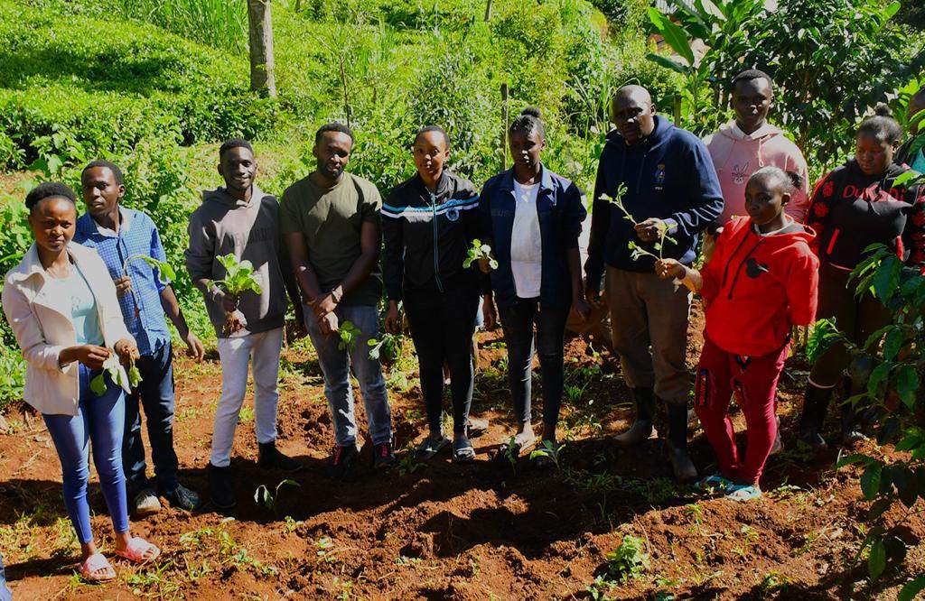 Learners and community members participating in environmental action