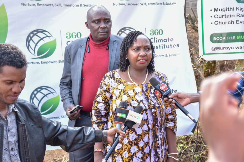 360 Climate Institutes Chairlady Hannah Muriithi addressing learners, guests and community