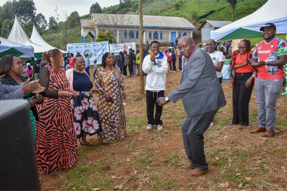 Director Paul Macharia joining the dance at the Murayas event