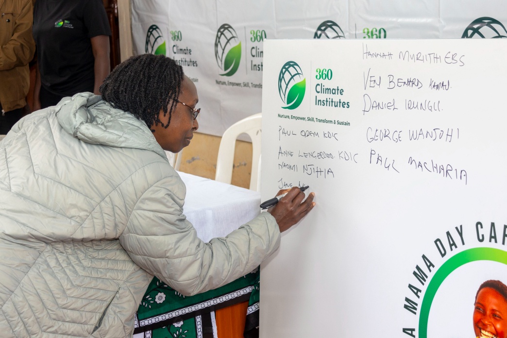 A guest participating in the signing moment during the Cha Mama launch.