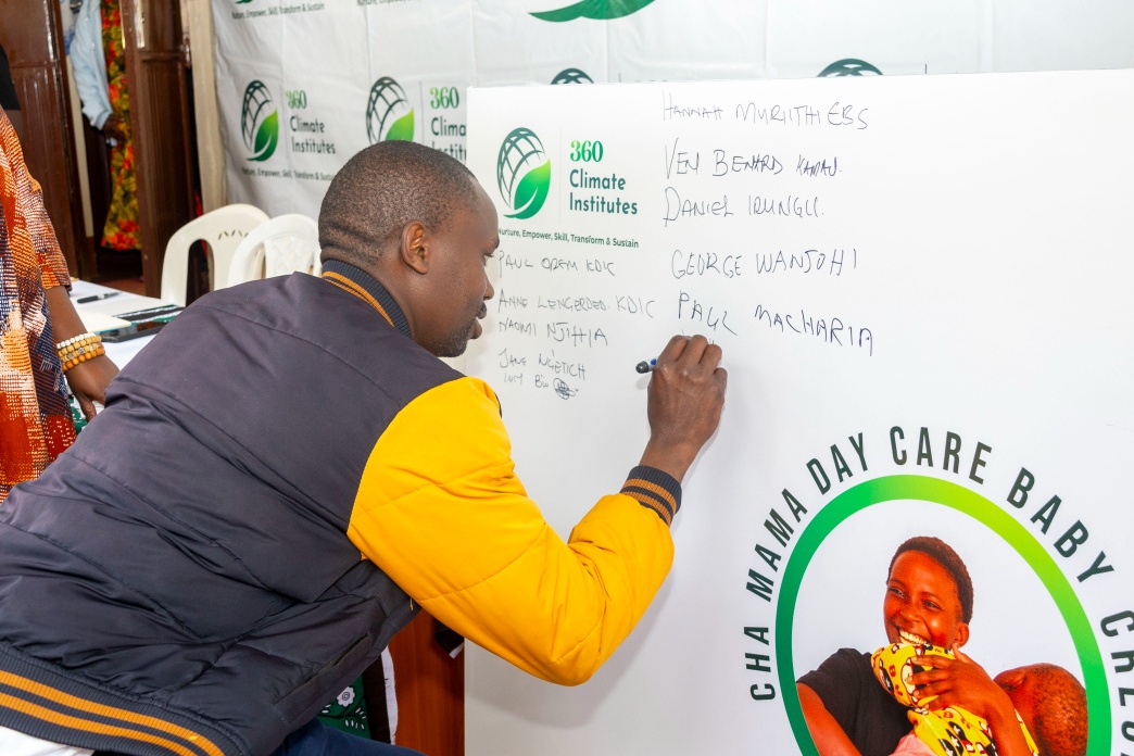 A guest taking part in the signing sequence during the Cha Mama launch.