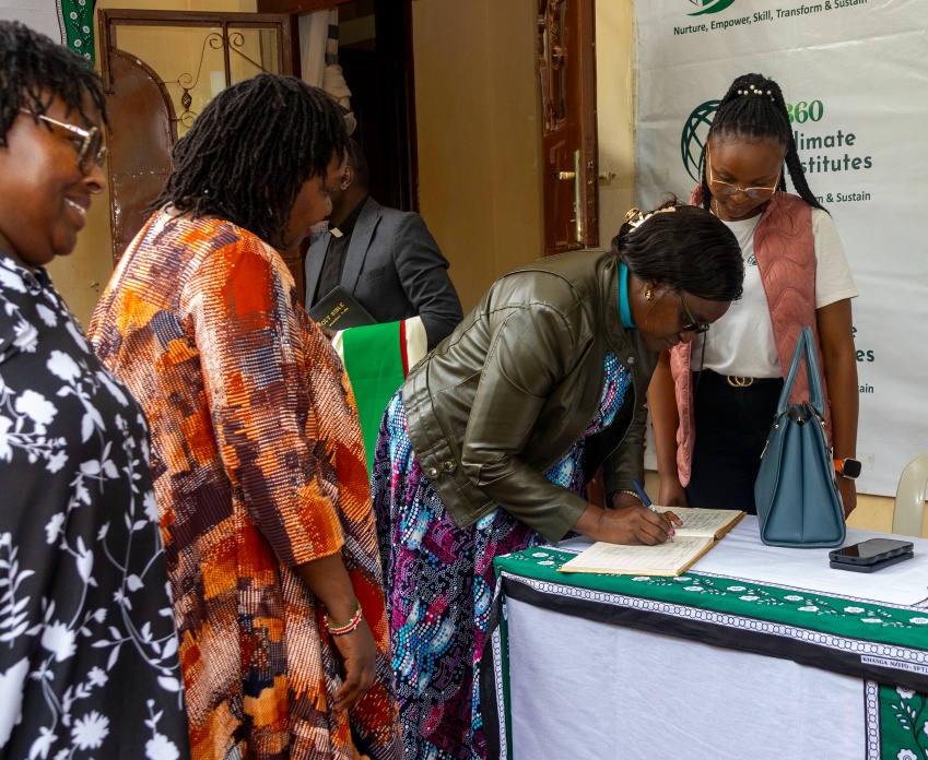 Kahuhia Girls principal participating in the Cha Mama launch registration moment.