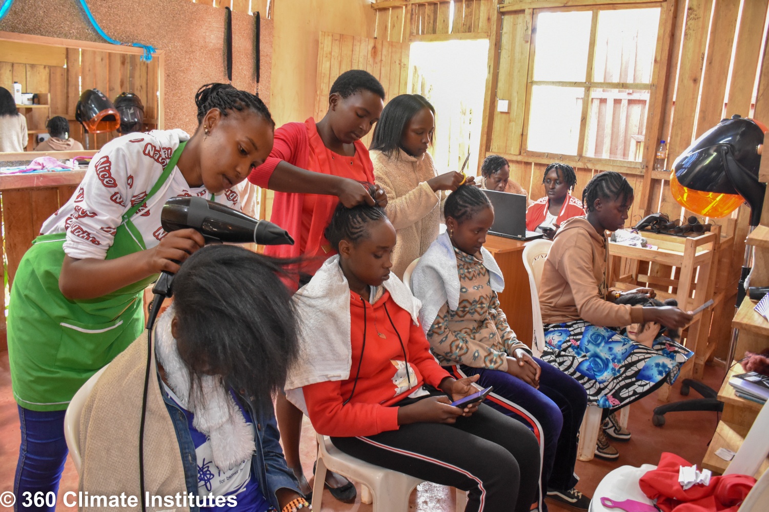 Students taking part in practical hairdressing training